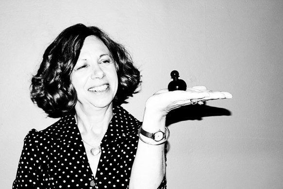 Candace with a smile, a spotty dress and a gorgeous bottle